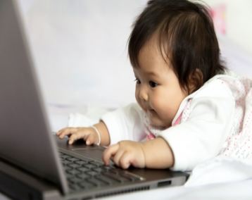 Baby playing computer