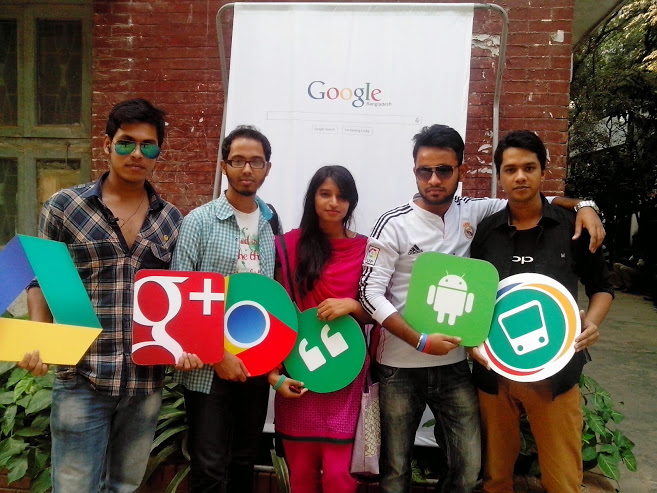 Students posing with some Google product icons